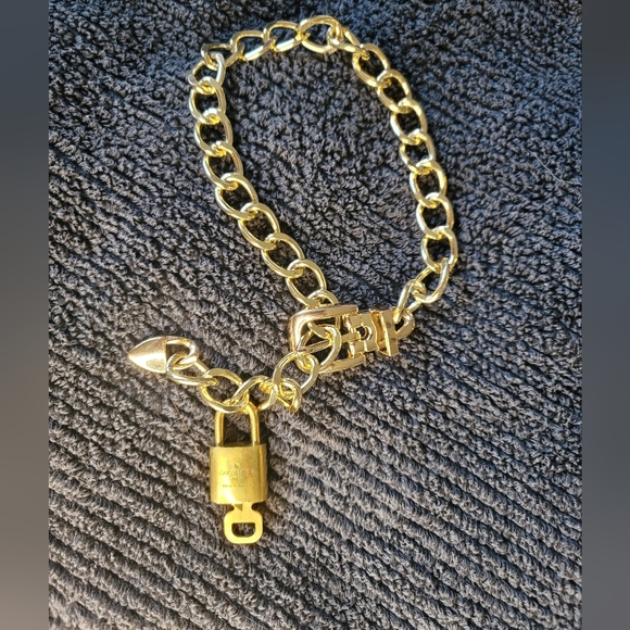 Louis Vuitton Other - Autheintic LOUIS VUITTON #308 Brass Lock And Key With Chain.  See Photos